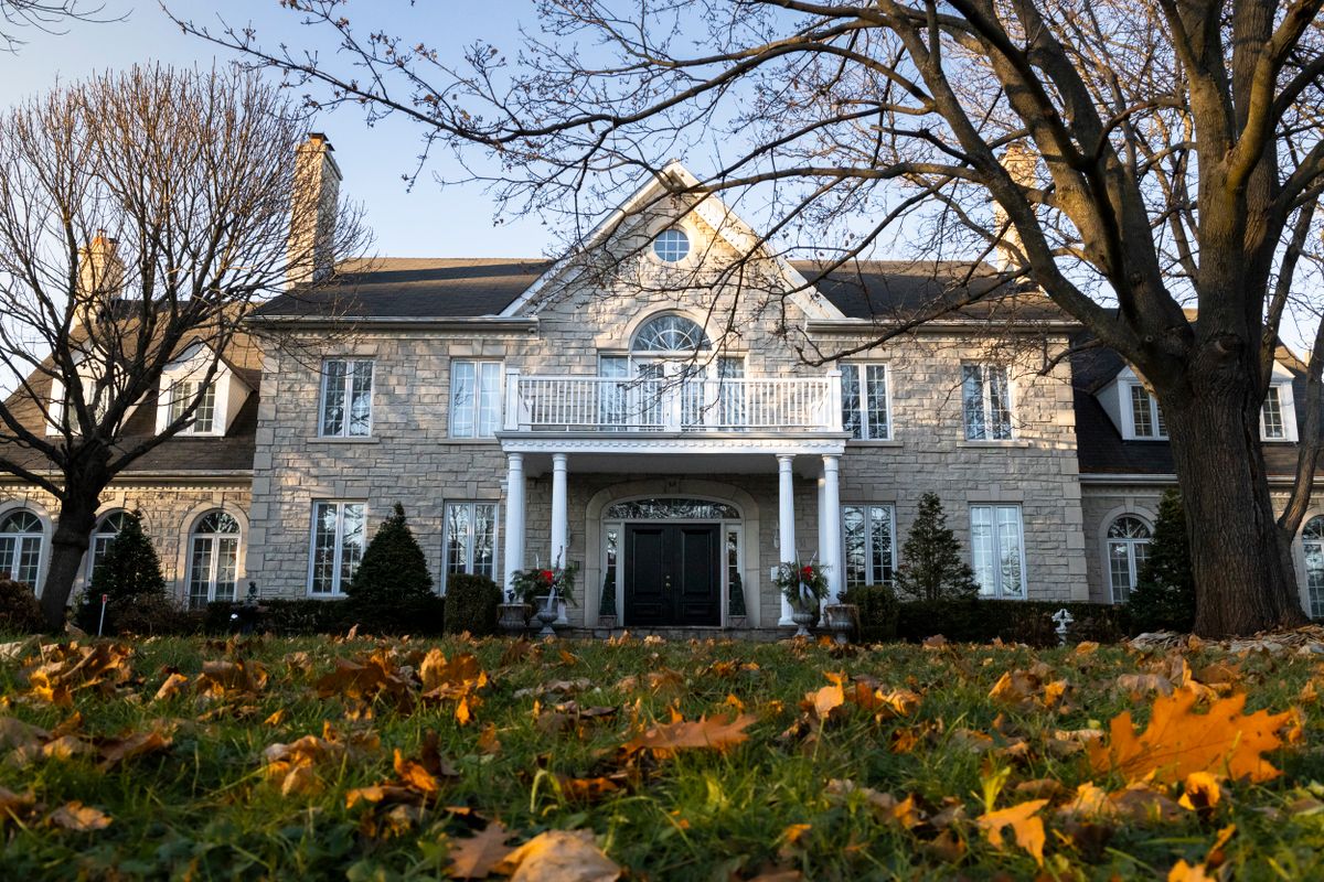 Classic stone American home in autumn
